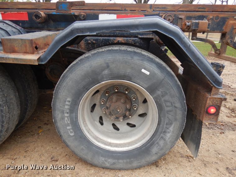 image for item JS9538 1999 Volvo WG  roll-off container truck