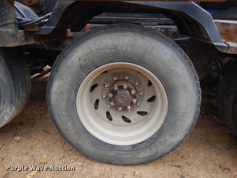 image for item JS9538 1999 Volvo WG  roll-off container truck