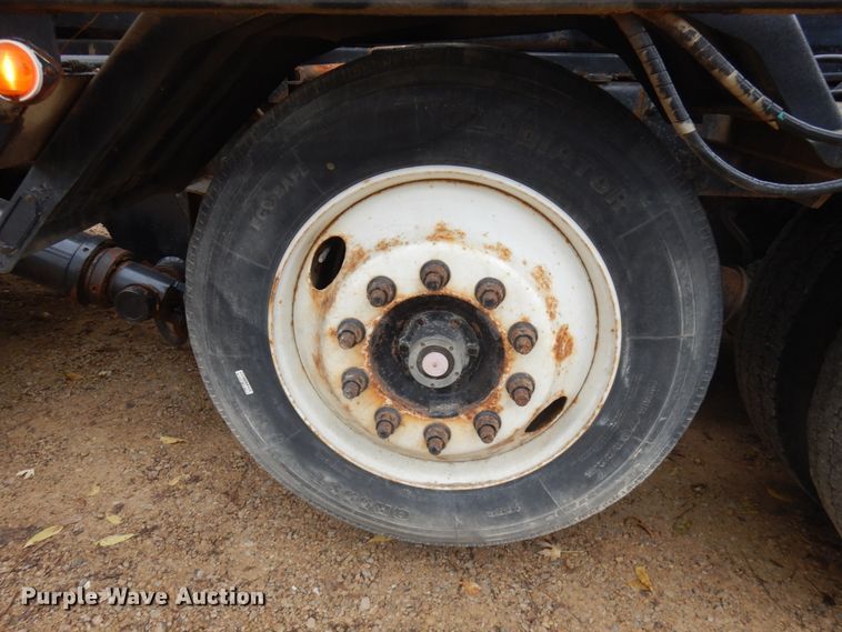 image for item JS9538 1999 Volvo WG  roll-off container truck