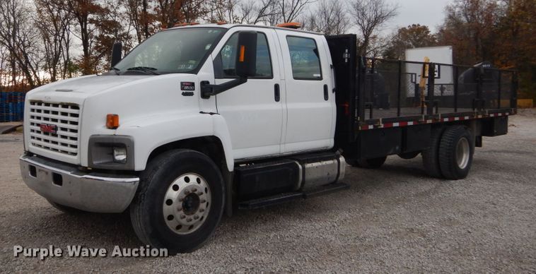 image for item IV9580 2004 GMC C6500  Crew Cab flatbed truck
