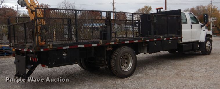 image for item IV9580 2004 GMC C6500  Crew Cab flatbed truck