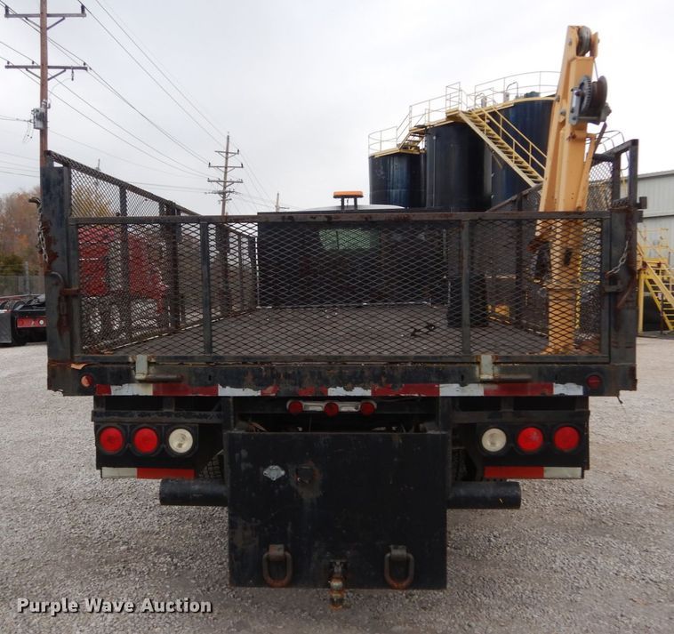 image for item IV9580 2004 GMC C6500  Crew Cab flatbed truck