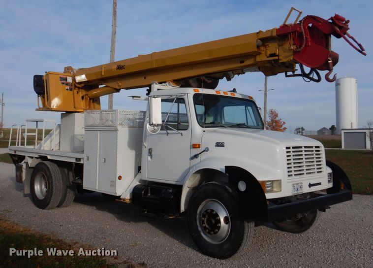 image for item DH8037 1999 International 4700  digger derrick truck
