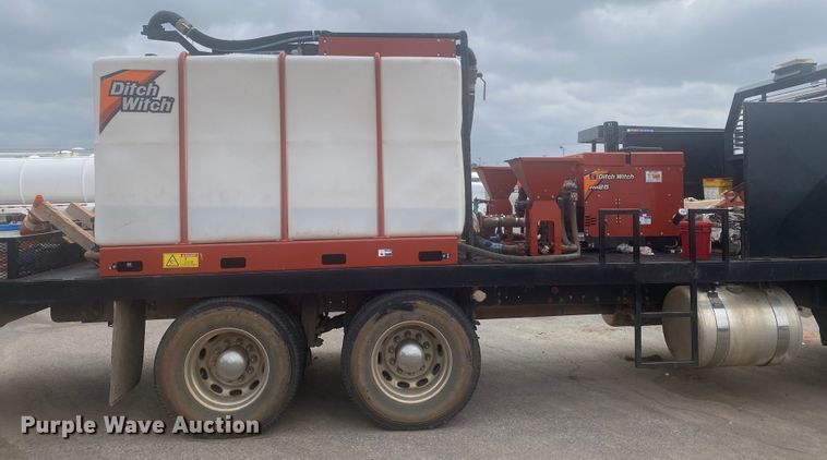 image for item DL6167 2012 Peterbilt 388  flatbed truck with mud mixer