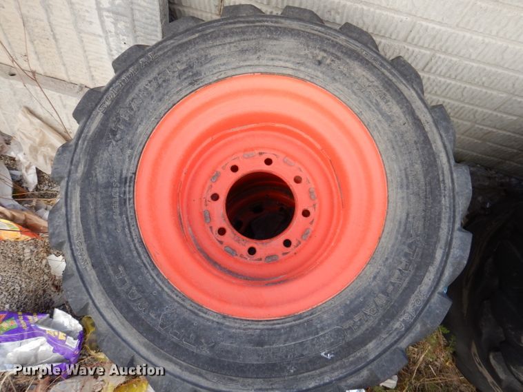 image for item KH9156 (4) 12-16.5 tires and wheels