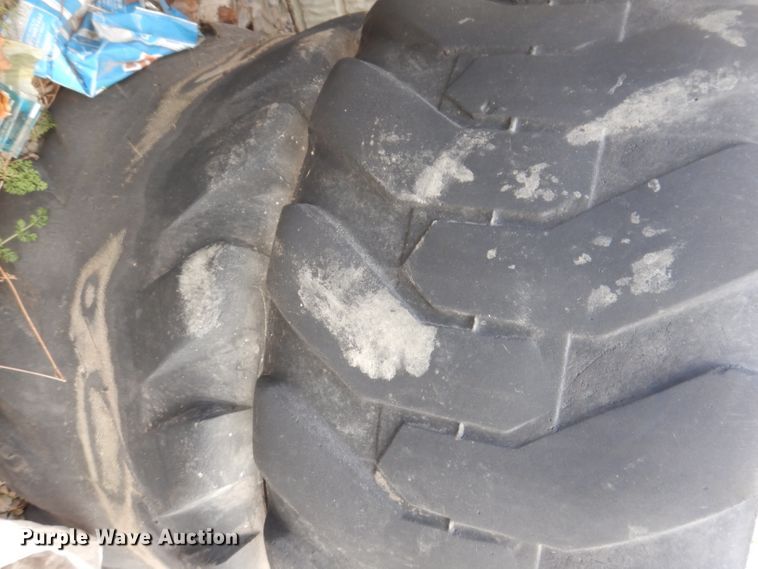 image for item KH9156 (4) 12-16.5 tires and wheels