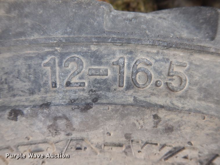 image for item KH9156 (4) 12-16.5 tires and wheels