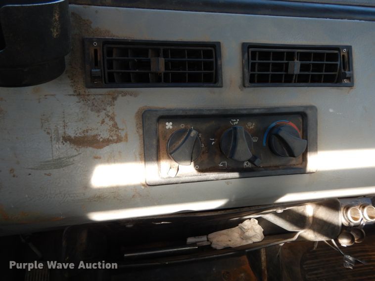 image for item DI8577 2004 Freightliner FL70  flatbed truck