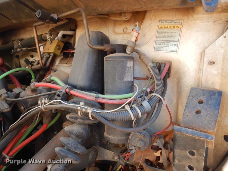 image for item DI8577 2004 Freightliner FL70  flatbed truck