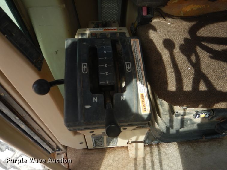 image for item DJ8888 1999 Caterpillar 140H  motor grader