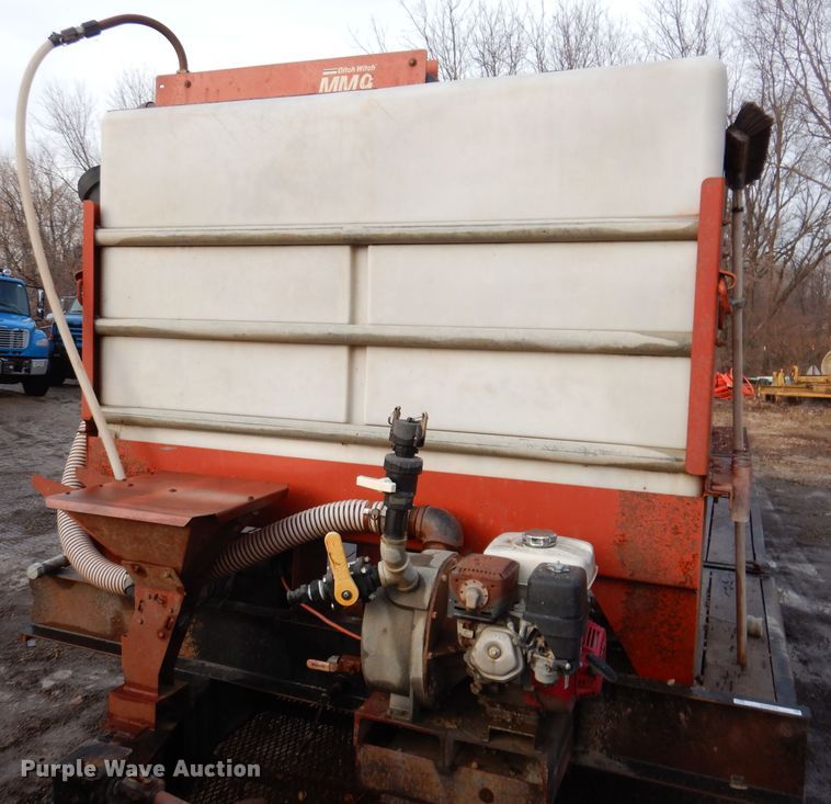 image for item KH9093 1993 Dynaweld  tilt deck equipment trailer with Ditch Witch MM9 mud mixer