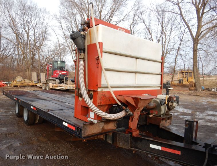 image for item KH9093 1993 Dynaweld  tilt deck equipment trailer with Ditch Witch MM9 mud mixer