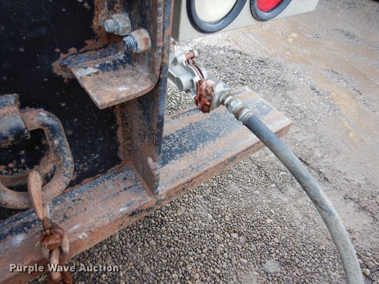 image for item KH9093 1993 Dynaweld  tilt deck equipment trailer with Ditch Witch MM9 mud mixer