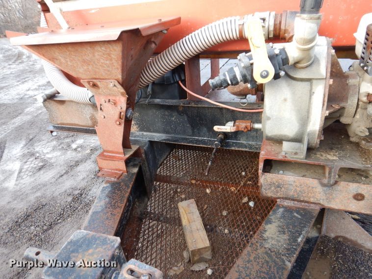 image for item KH9093 1993 Dynaweld  tilt deck equipment trailer with Ditch Witch MM9 mud mixer