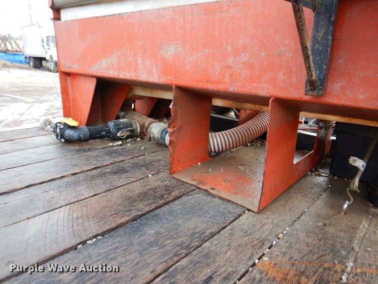 image for item KH9093 1993 Dynaweld  tilt deck equipment trailer with Ditch Witch MM9 mud mixer