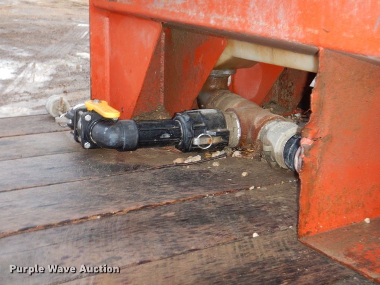 image for item KH9093 1993 Dynaweld  tilt deck equipment trailer with Ditch Witch MM9 mud mixer