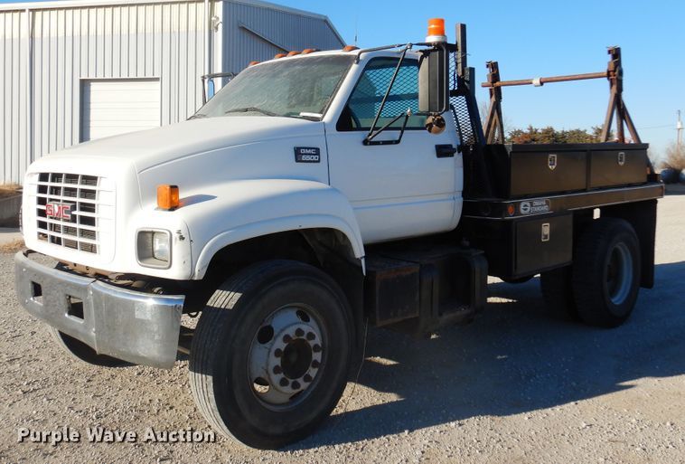 image for item JJ9832 1997 GMC C7500  flatbed truck