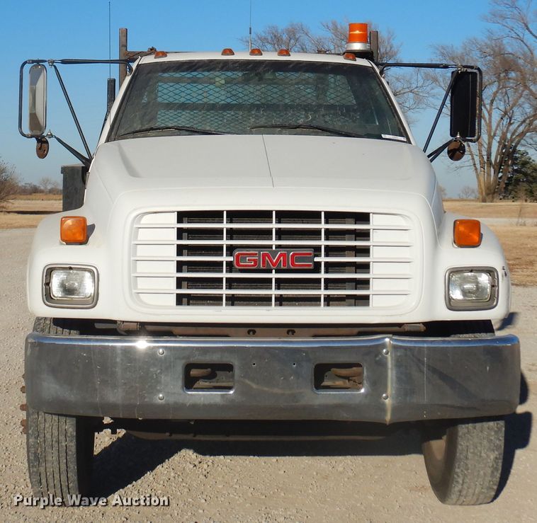 image for item JJ9832 1997 GMC C7500  flatbed truck