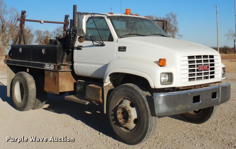 image for item JJ9832 1997 GMC C7500  flatbed truck