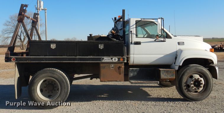 image for item JJ9832 1997 GMC C7500  flatbed truck