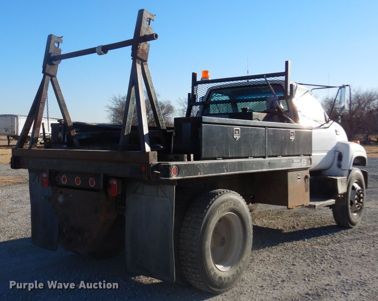 image for item JJ9832 1997 GMC C7500  flatbed truck