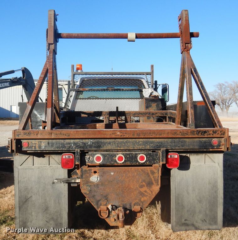 image for item JJ9832 1997 GMC C7500  flatbed truck