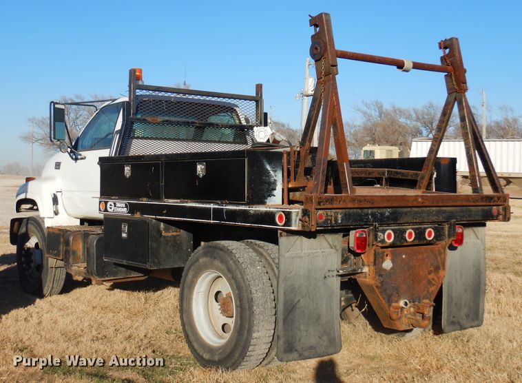 image for item JJ9832 1997 GMC C7500  flatbed truck