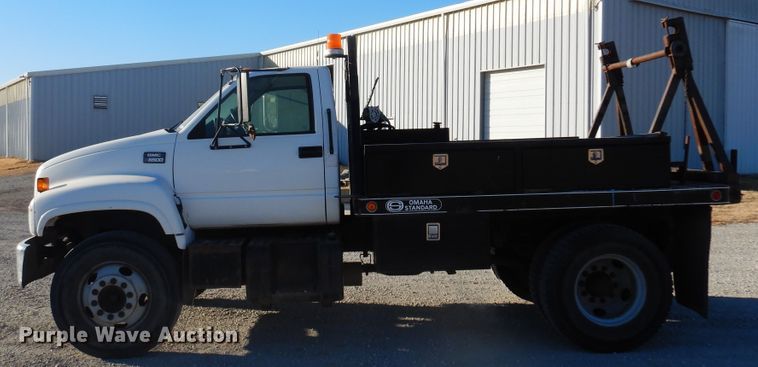 image for item JJ9832 1997 GMC C7500  flatbed truck
