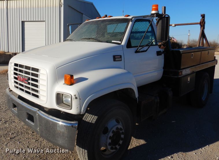 image for item JJ9832 1997 GMC C7500  flatbed truck
