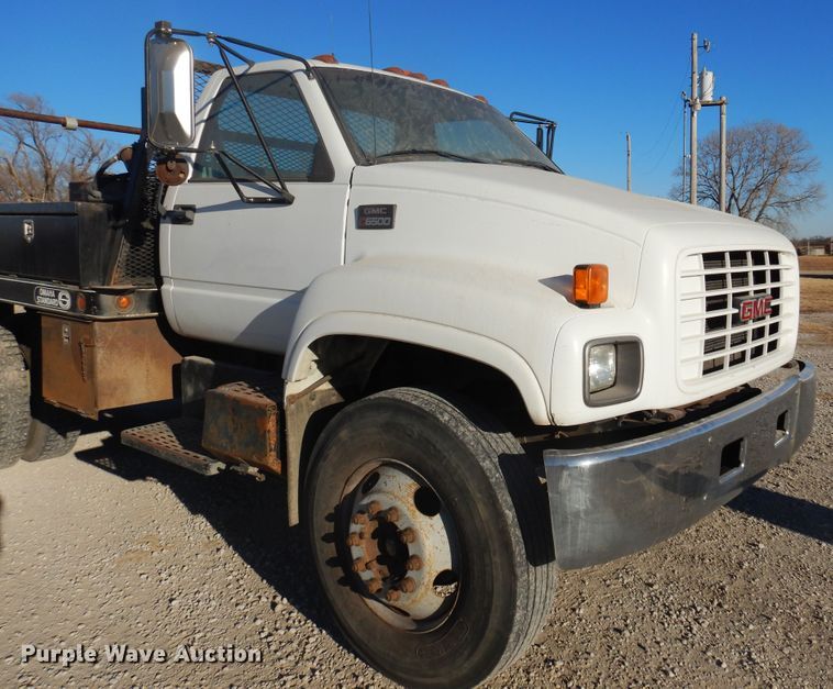 image for item JJ9832 1997 GMC C7500  flatbed truck
