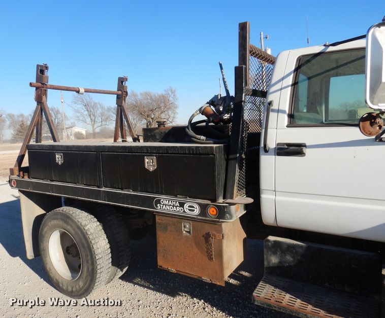 image for item JJ9832 1997 GMC C7500  flatbed truck