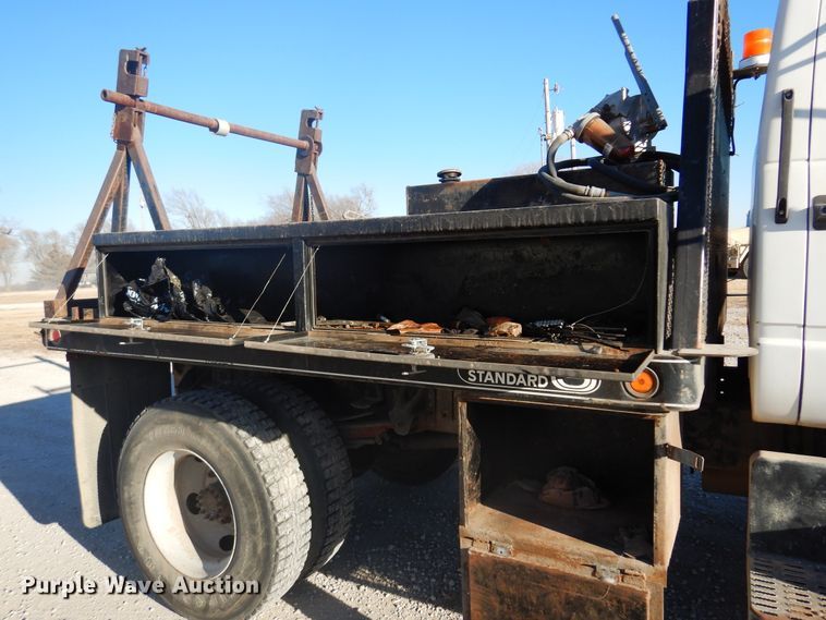 image for item JJ9832 1997 GMC C7500  flatbed truck