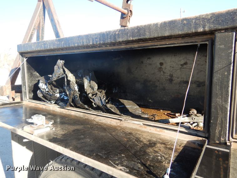 image for item JJ9832 1997 GMC C7500  flatbed truck