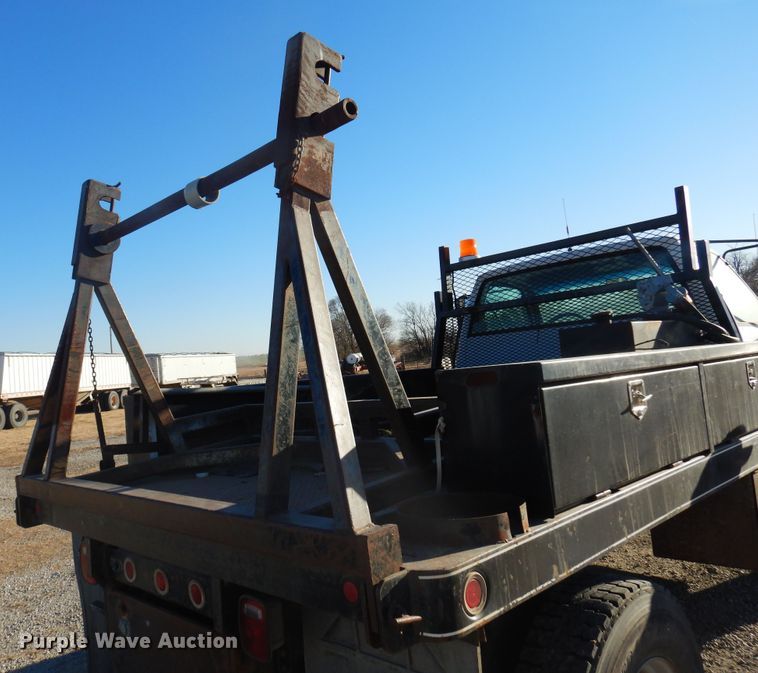image for item JJ9832 1997 GMC C7500  flatbed truck