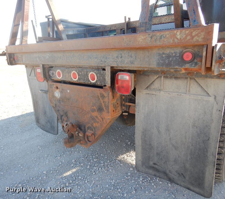 image for item JJ9832 1997 GMC C7500  flatbed truck