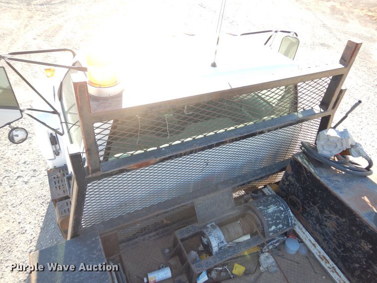 image for item JJ9832 1997 GMC C7500  flatbed truck