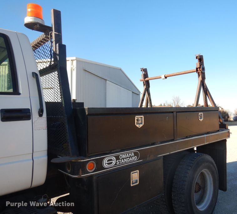 image for item JJ9832 1997 GMC C7500  flatbed truck