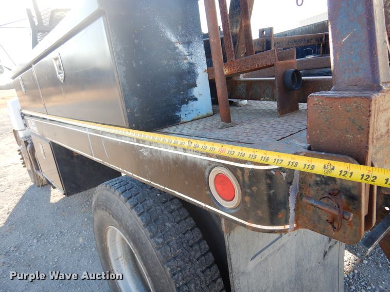 image for item JJ9832 1997 GMC C7500  flatbed truck