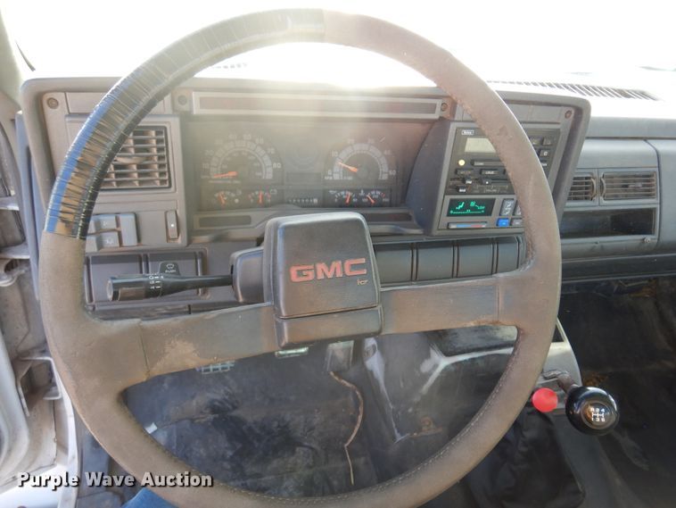 image for item JJ9832 1997 GMC C7500  flatbed truck