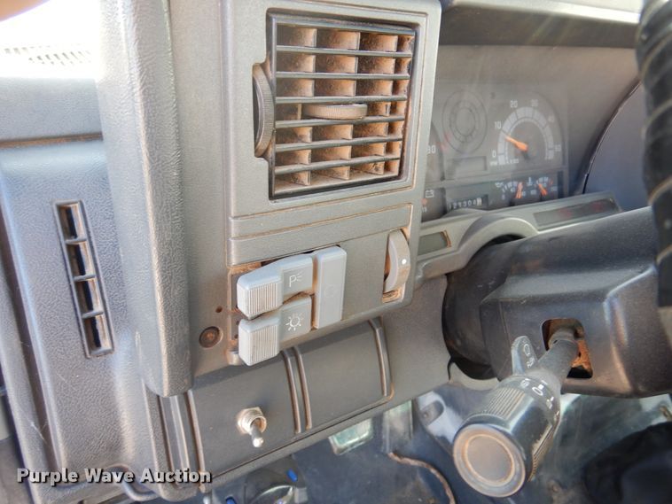 image for item JJ9832 1997 GMC C7500  flatbed truck