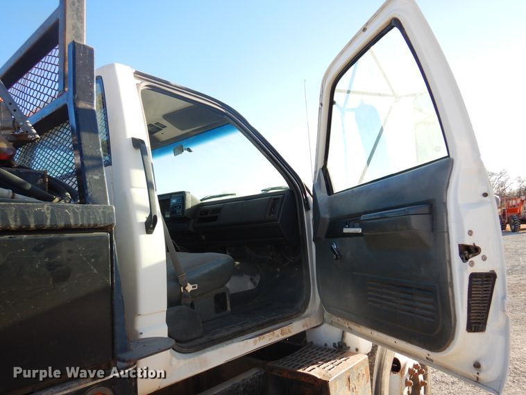 image for item JJ9832 1997 GMC C7500  flatbed truck