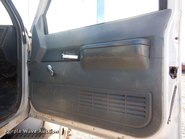 image for item JJ9832 1997 GMC C7500  flatbed truck