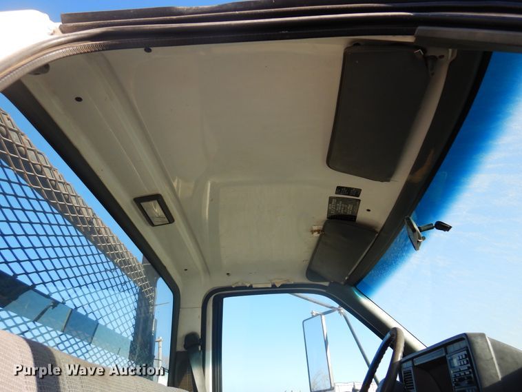 image for item JJ9832 1997 GMC C7500  flatbed truck