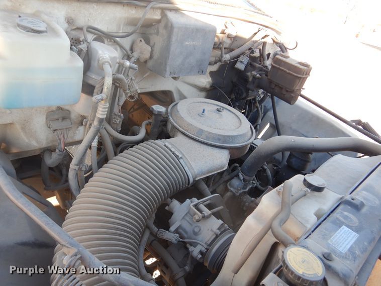 image for item JJ9832 1997 GMC C7500  flatbed truck