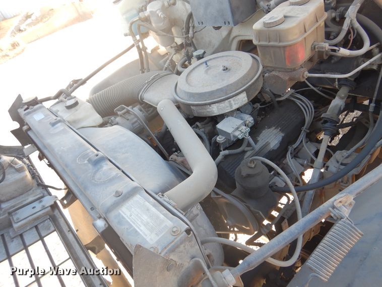 image for item JJ9832 1997 GMC C7500  flatbed truck