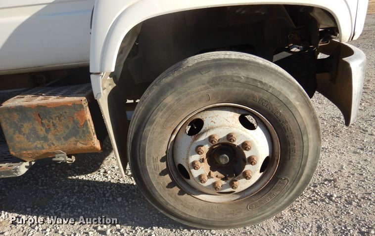 image for item JJ9832 1997 GMC C7500  flatbed truck