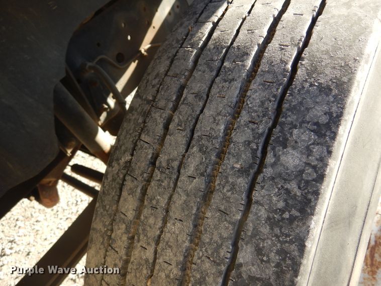 image for item JJ9832 1997 GMC C7500  flatbed truck