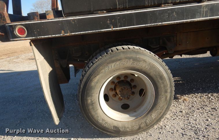 image for item JJ9832 1997 GMC C7500  flatbed truck