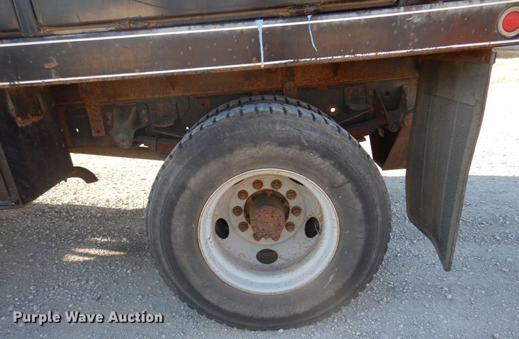 image for item JJ9832 1997 GMC C7500  flatbed truck