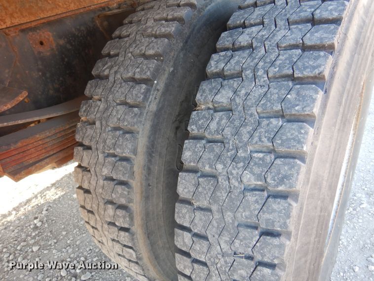 image for item JJ9832 1997 GMC C7500  flatbed truck